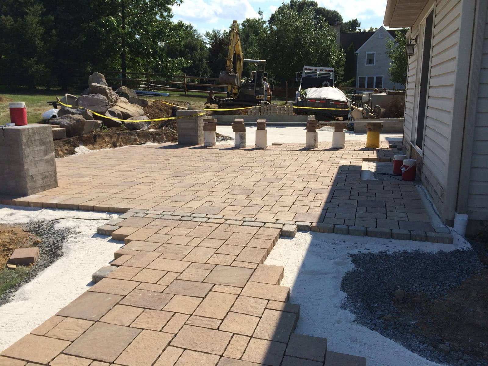 When we started to install the low maintenance paver patio, the homeowners were ecstatic over the gained square footage!