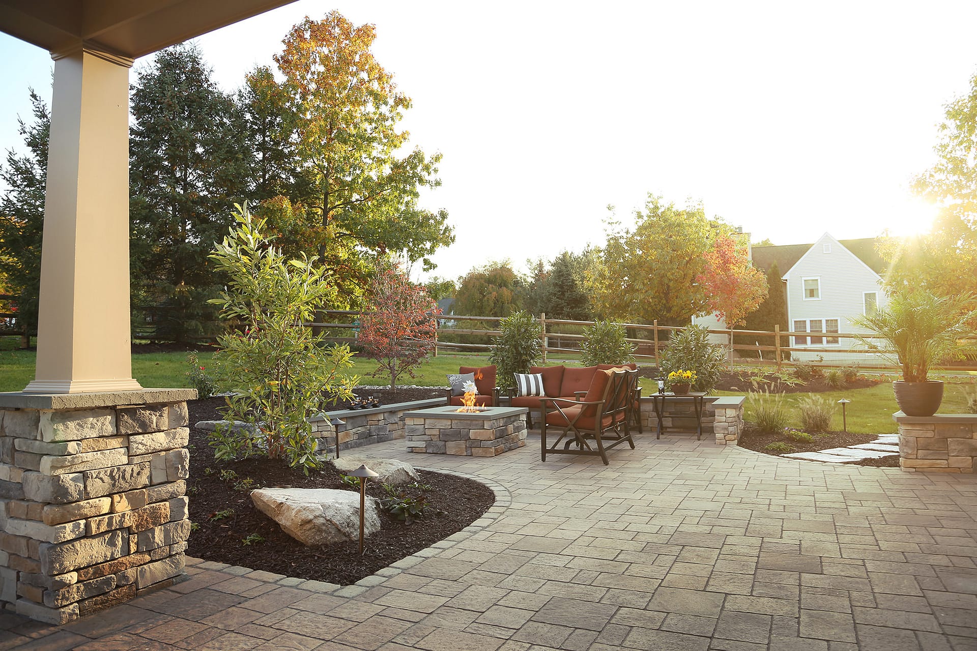 Including a natural gas fire pit into the patio provides a warm destination for the whole family to gather around and make memories.