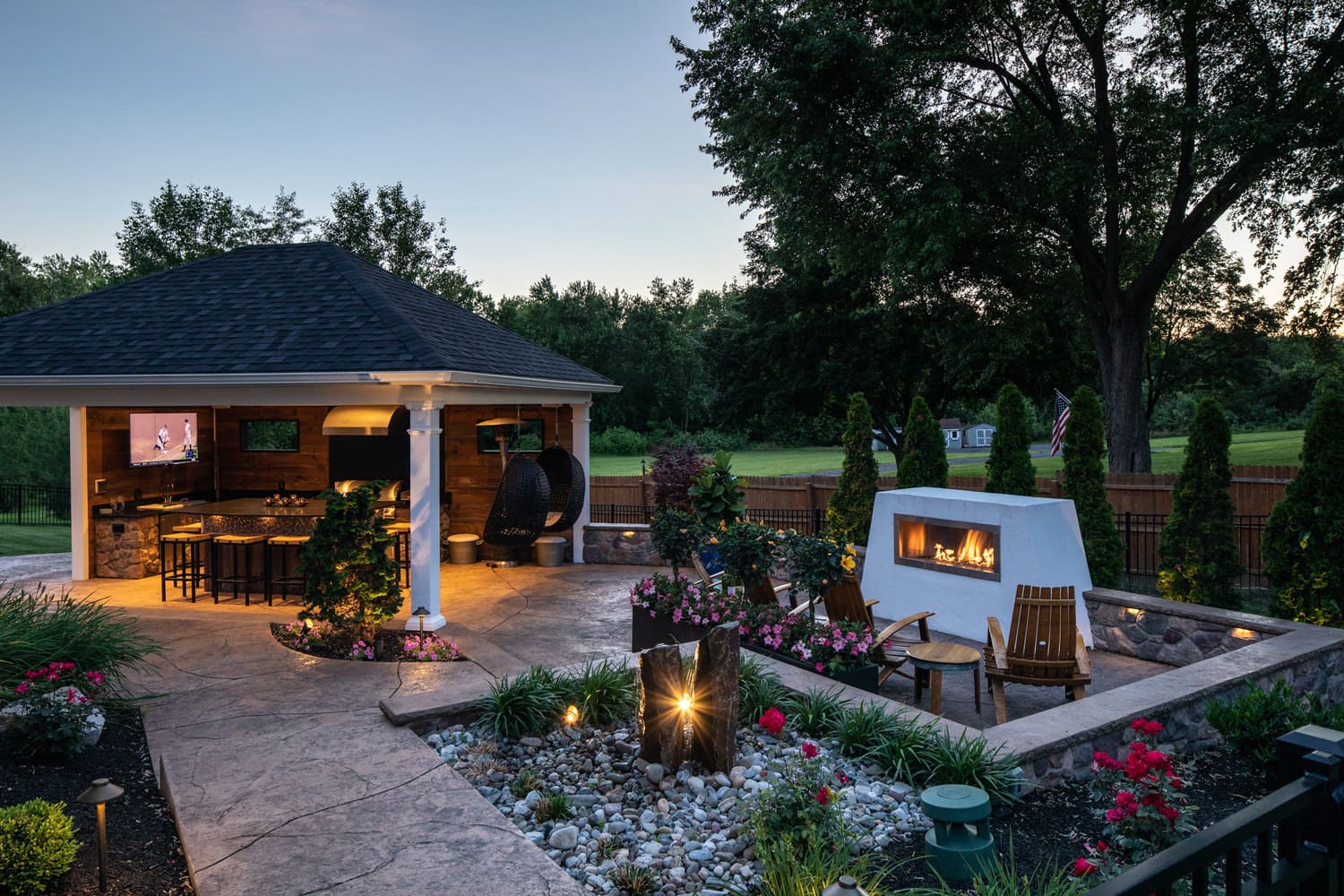 This photo captures the perfect balance between structure and landscape supporting and complementing each other to create a lovely and harmonious outdoor living space.