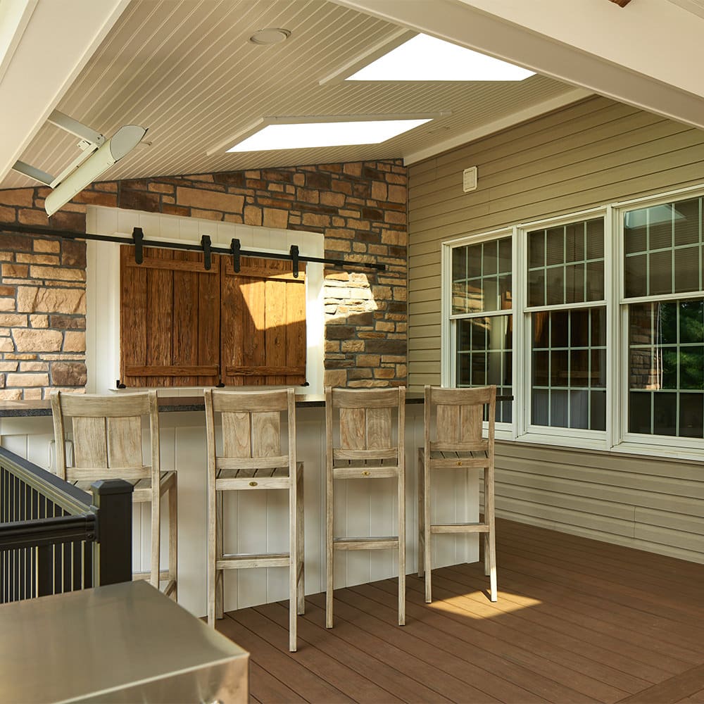 Strategically placed skylights in your outdoor living space will allow natural light to flood back into your home. This eliminates the cave-like effect so many worry about when wanting an attached roof system.