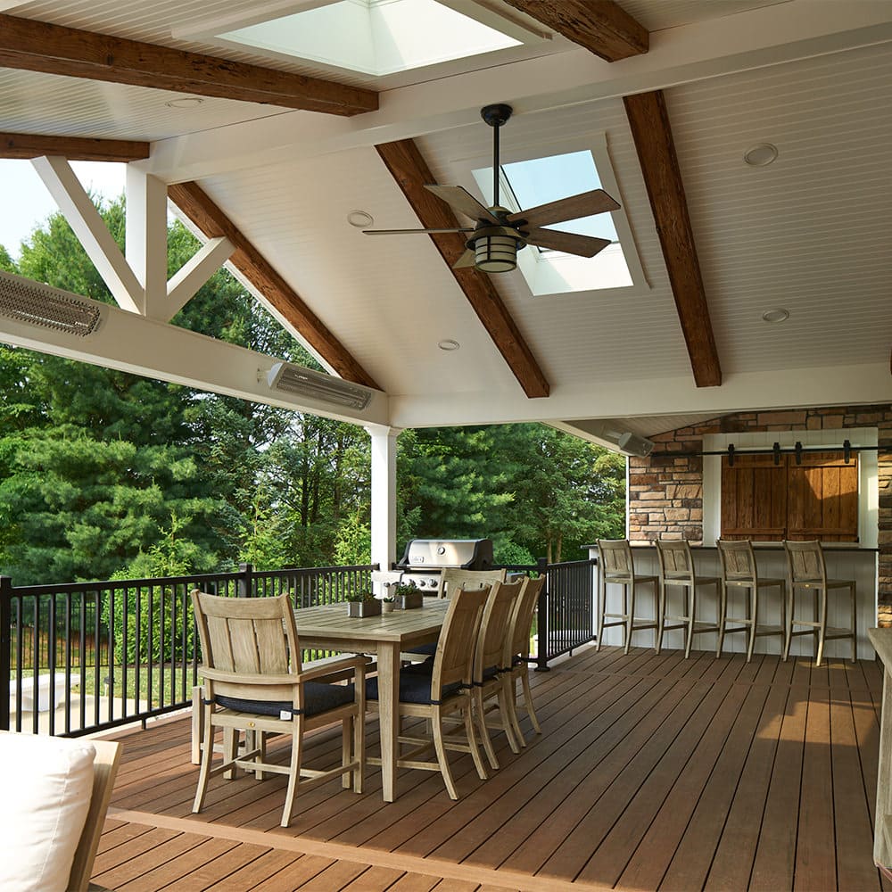 Open roof gables paired with strategically placed skylights allow this outdoor living space to be light, airy and bright!