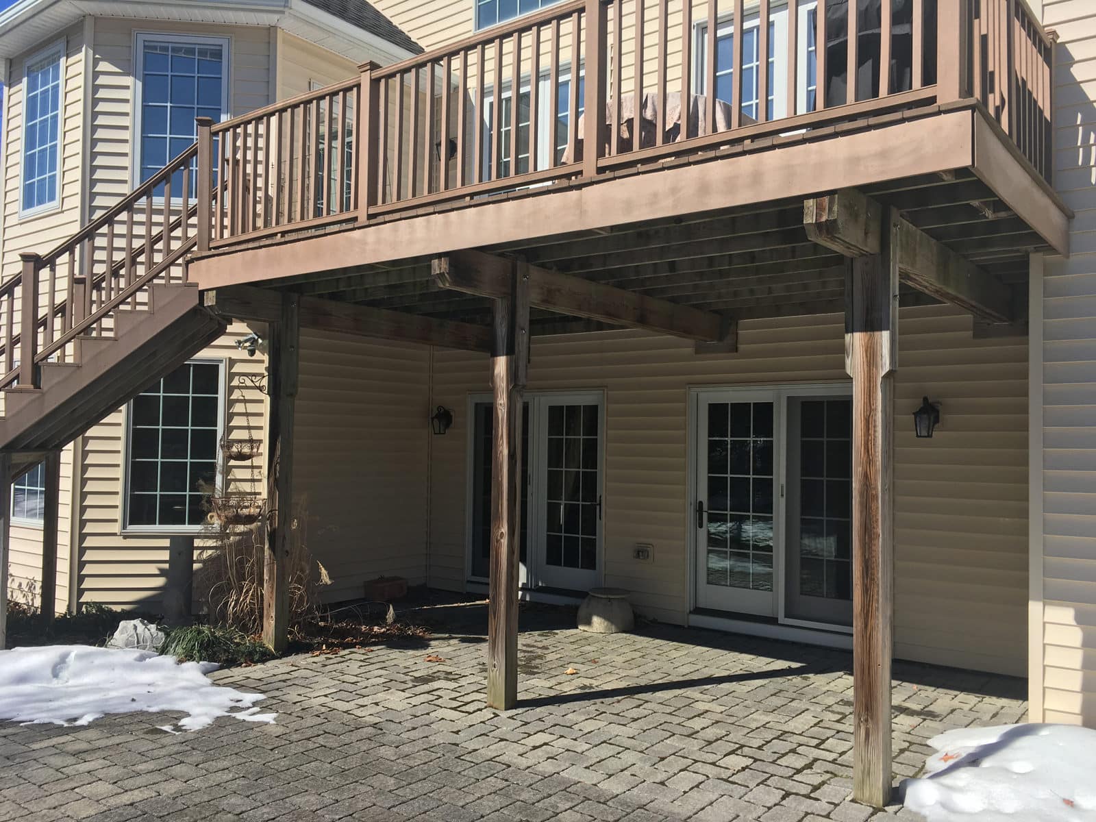 The construction of the previous deck was unappealing to look at. This under deck space was very uninviting and the deck itself was too small to do much of anything!