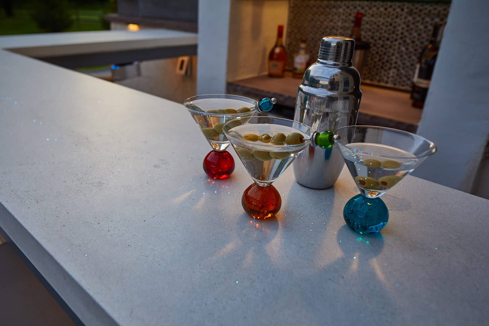The bar area is complete with a 2” thick custom concrete countertop adorned with thousands of hand placed fiber optics throughout, flowing like a constellation!