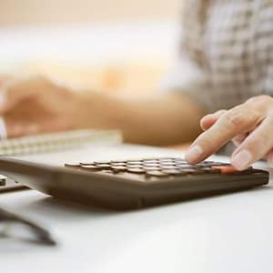 woman using calculator