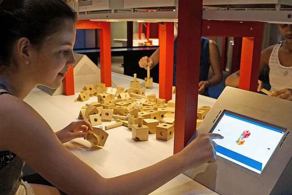 child learning at museum