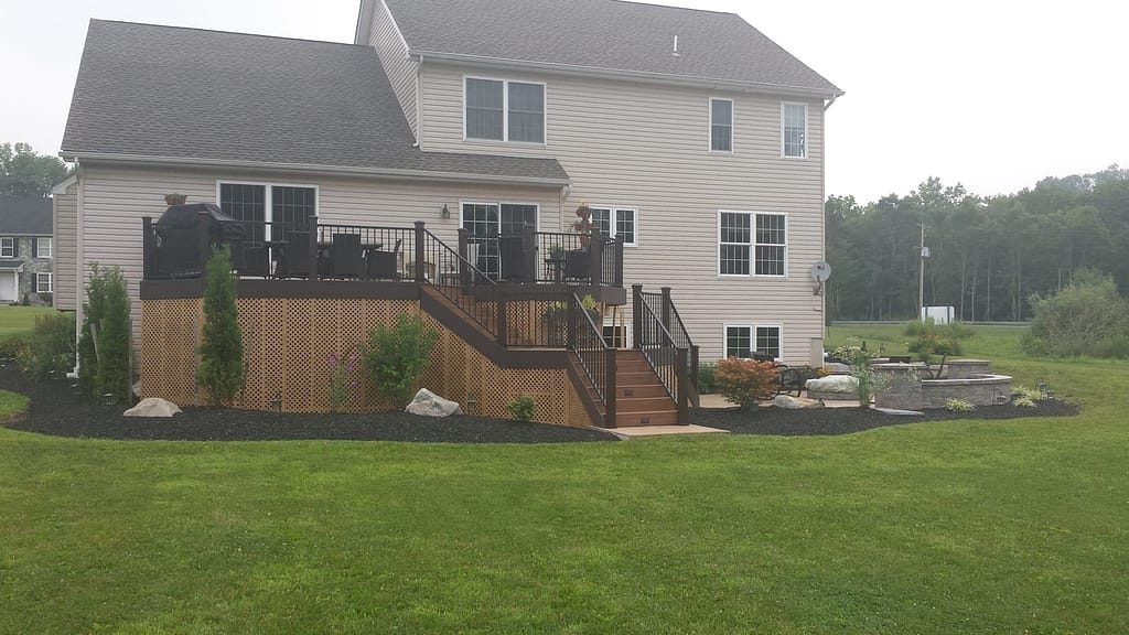 A deck and patio with landscaping