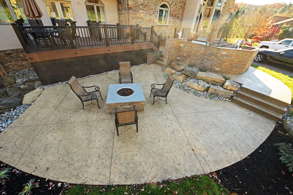 A stamped concrete with a gas powered fire pit
