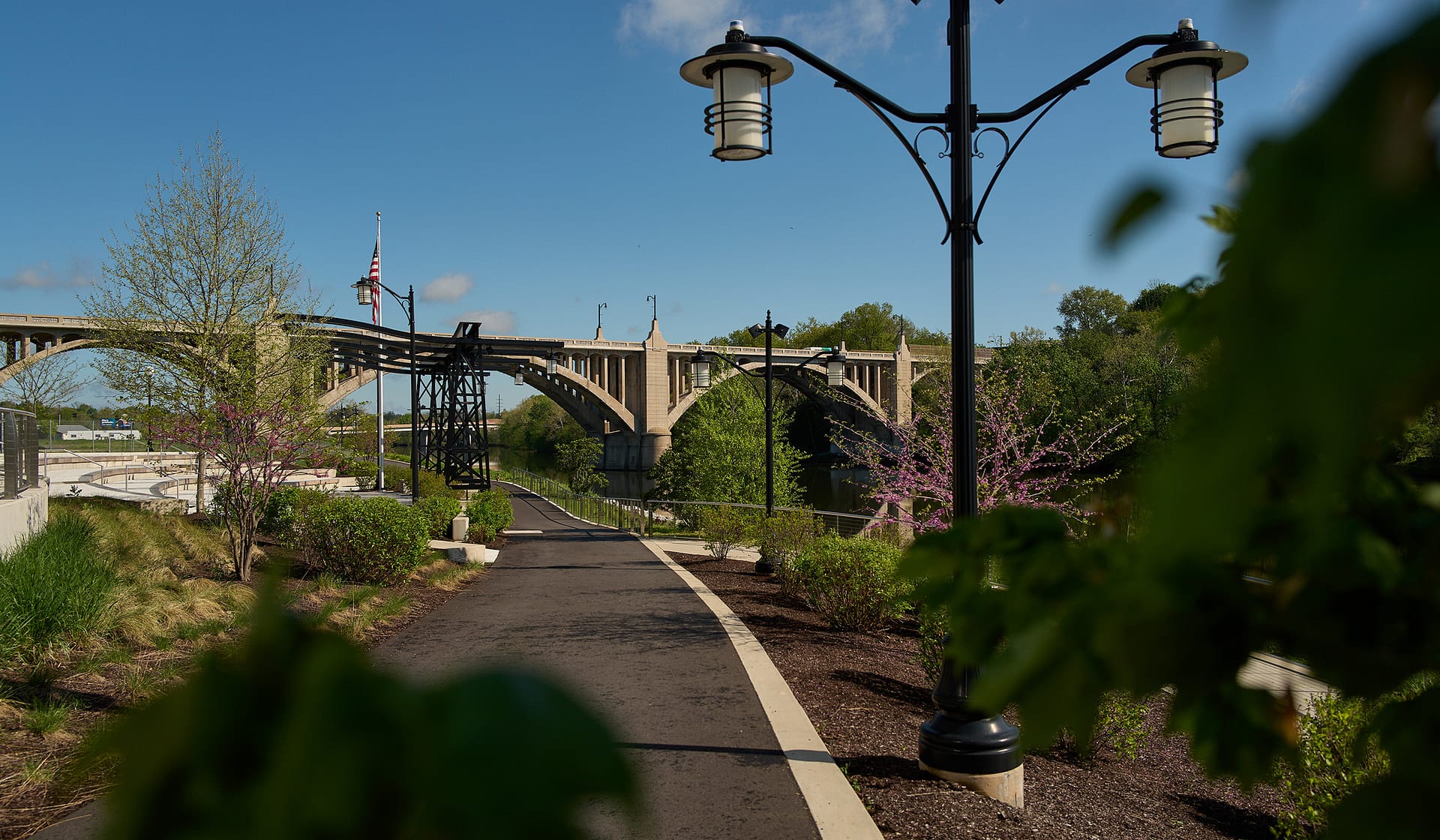 Lamplit River Walk path winding through The Waterfront in Allentown