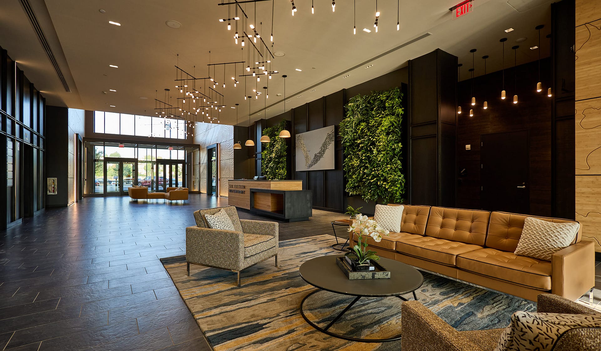 Spacious 615 Waterfront lobby lounge with sofas and area rug in Allentown, Pennsylvania
