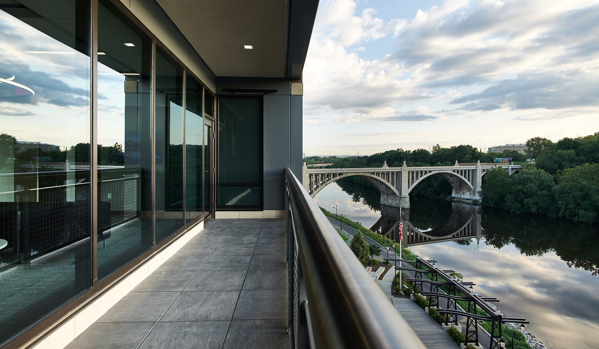Arched bridge over the Lehigh River seen from a 615 Waterfront office balcony