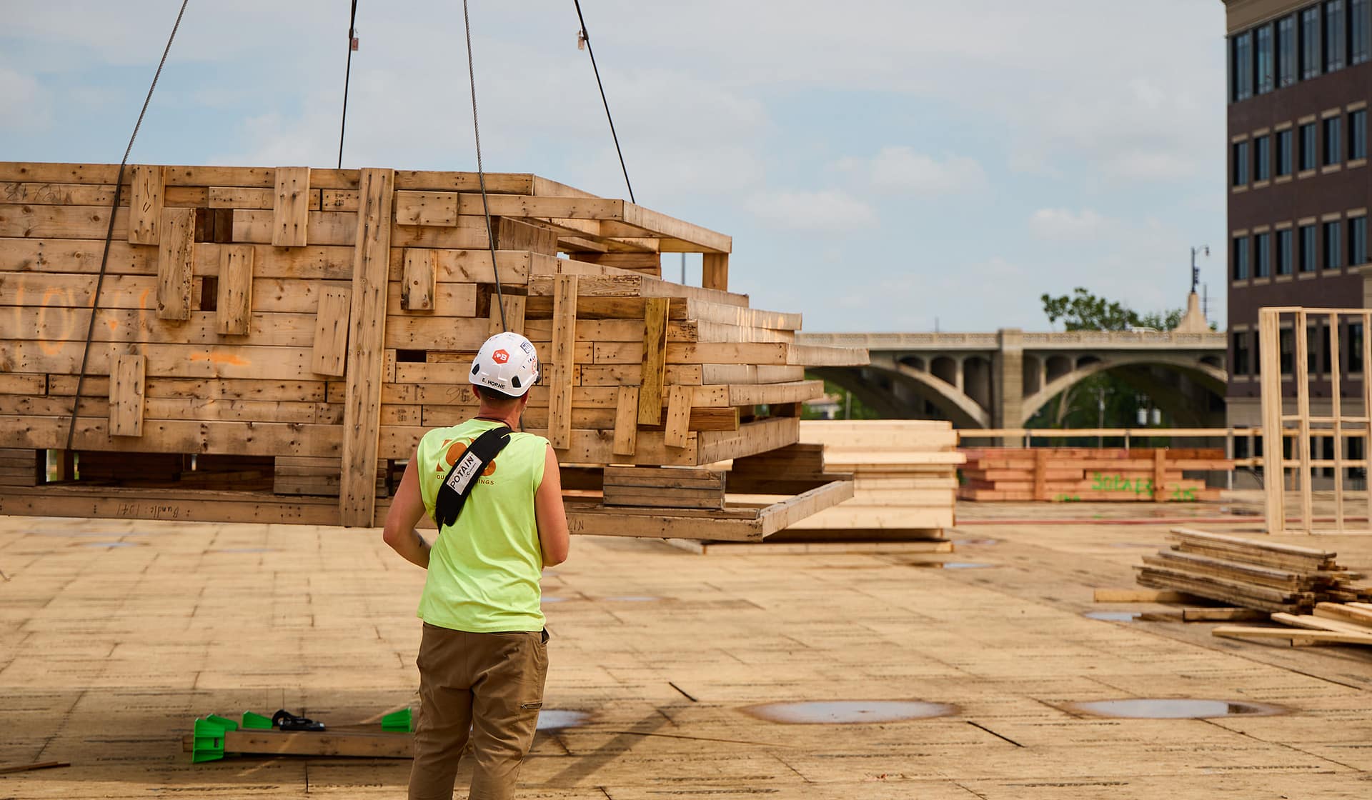 Framing crew working atop a wood-framed deck at River House in Allentown