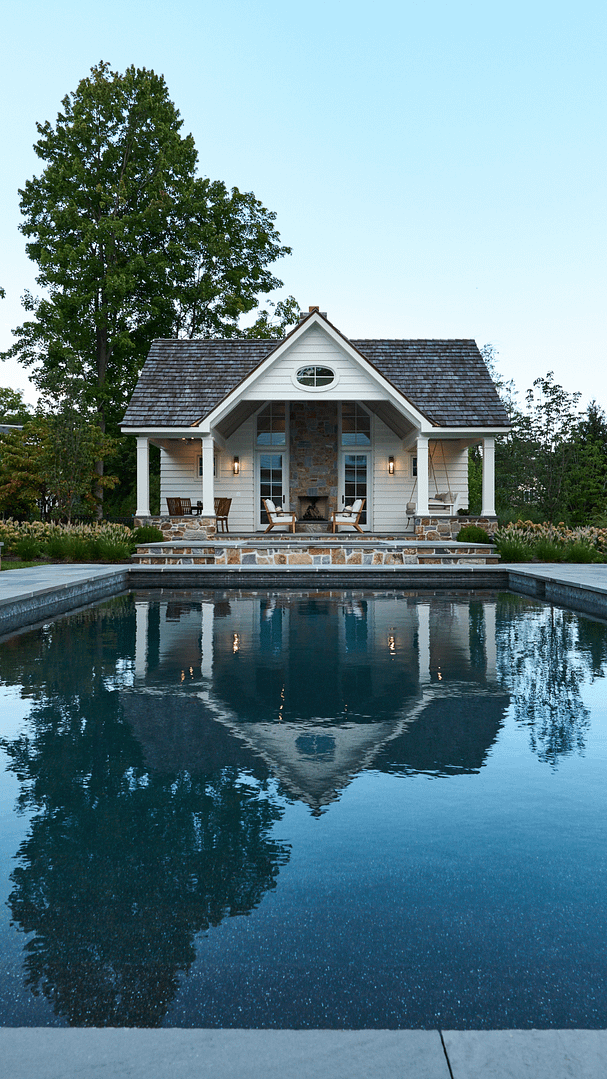 Match the architecture: A pool house designed as a natural extension of the main home.